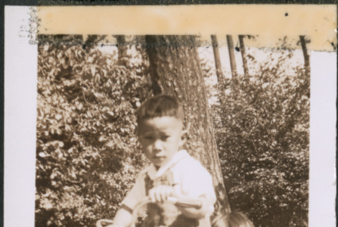 Two children on a tricycle (ddr-densho-483-1076)