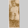 Girl standing in garden (ddr-densho-426-1475)