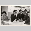Group standing at counter (ddr-densho-426-67)