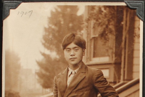 Nikkei wearing a suit and boots (ddr-densho-259-403)