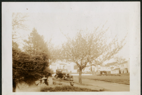 Car parked on the street (ddr-densho-359-925)