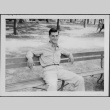 Man sitting on bench (ddr-densho-434-495)