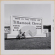 Hardy and Susan Shiomi standing by Tillamook Cheese Factory sign (ddr-densho-522-557)