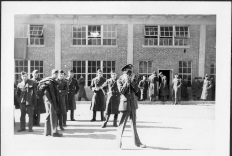 Group of men in uniform outside building (ddr-densho-434-478)