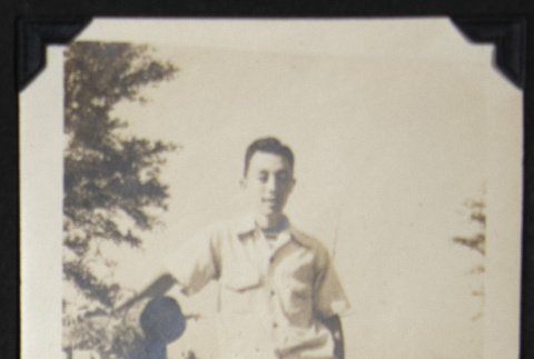 Man standing on a Rohwer bridge (ddr-densho-542-599)