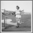 Nisei woman poses at airfield (ddr-densho-363-71)
