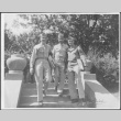 Three men on steps, William Tsuchida in center (ddr-densho-434-454)