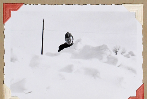 Man stands behind mound of snow (ddr-densho-404-407)