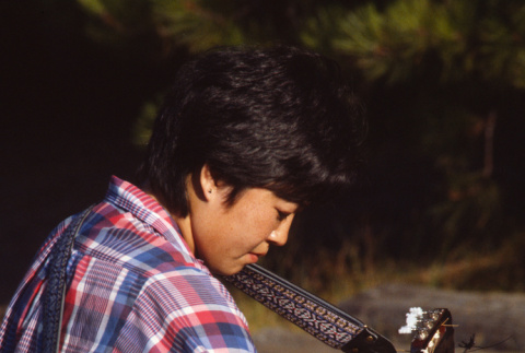 Mariko Yanagisawa playing guitar (ddr-densho-336-1474)