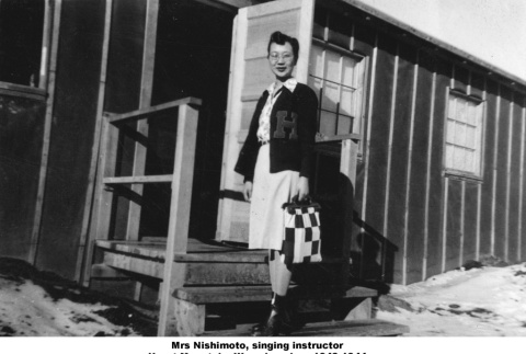 Woman standing at entrance to barracks (ddr-ajah-2-921)
