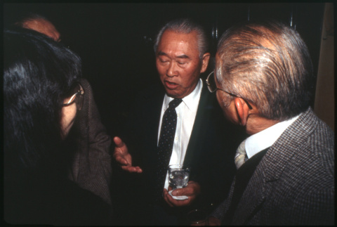 Man with drinks talking (ddr-densho-1007-733)