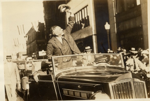 Alfred M. Landon waving from a parade car (ddr-njpa-1-851)