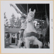 Leslie Shiomi on Merry-go-round (ddr-densho-522-421)