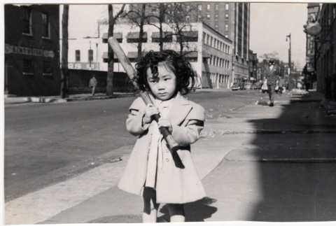 Diana Lynn Reiko Morita Cole holidng baseball bat on sidewalk (ddr-densho-409-28)