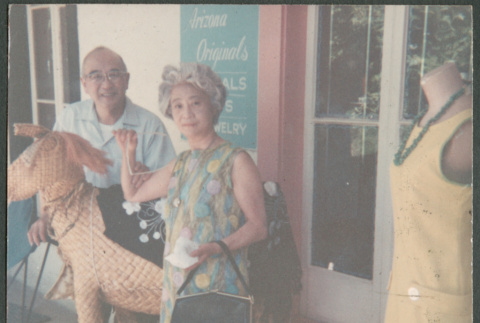 Chester and Agnes Sakura outside shop (ddr-densho-523-458)