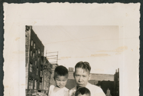 Photo of a man with two children (ddr-densho-483-791)
