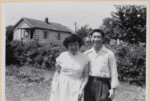 Couple in yard with house in background (ddr-densho-522-49)