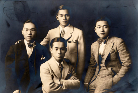 Portrait of four young men in suits (ddr-densho-474-161)
