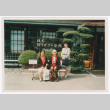 Mitsuye Yabe and Friends in Front of Sign (ddr-ohs-1-175)