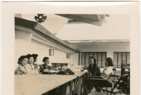 Group of women sitting around a table (ddr-densho-426-2069)
