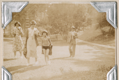 Four people walking in Mount Baker Park (ddr-densho-383-141)