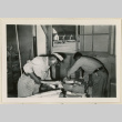 Two workers checking baggage (ddr-densho-37-884)