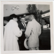 Tomoye Takahashi standing with two men (ddr-densho-426-852)