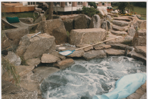 Hot tub with rock landscaping (ddr-densho-377-1963)