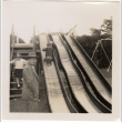 Boy on slide on playground (ddr-densho-426-39)