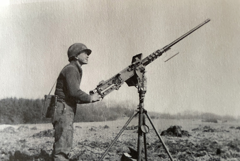 Kazuyoshi Kawata with an artillery gun (ddr-densho-496-11)