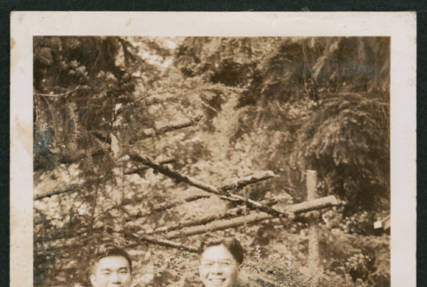 Photo of two men in a garden (ddr-densho-483-353)