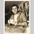 Man with a cup and cigarette (ddr-densho-542-809)