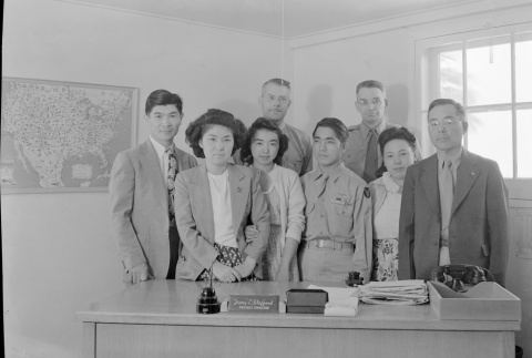 A soldier and others gathered in Harry L. Stafford's office (ddr-fom-1-368)