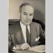 Man posing at his desk (ddr-njpa-2-932)