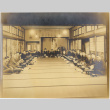 Photo of large group of men and women seated on tatami mats (ddr-densho-422-430)