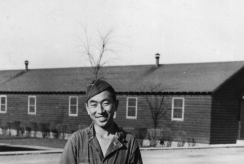 Joe Iwataki in yard outside barracks (ddr-ajah-2-798)