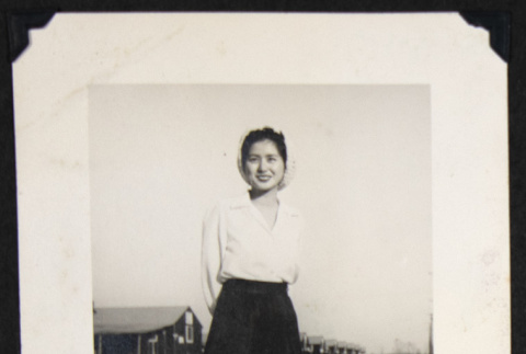 Woman on a wooden footpath (ddr-densho-542-736)