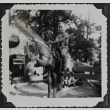 A boy on a mechanical pony (ddr-densho-300-483)