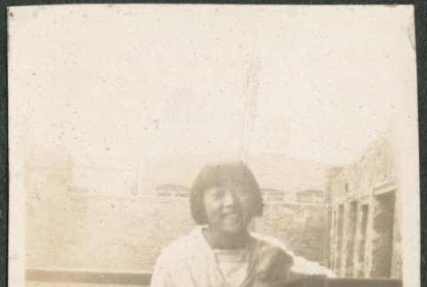 Girl standing by railing (ddr-densho-293-71)