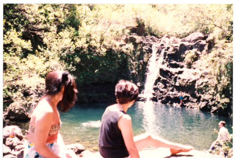 Tomi Iino and young woman looking at waterfall (ddr-densho-368-313)