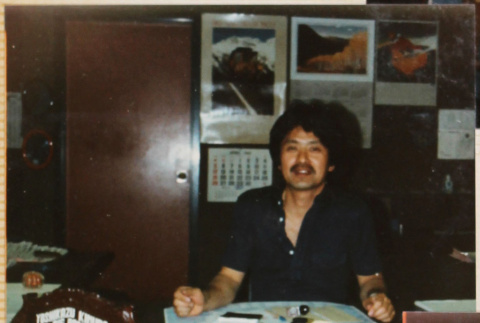 Man sitting at desk (ddr-densho-426-1348)