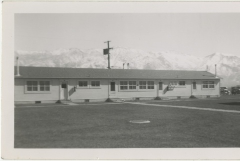 Grassy field in front of administrative building (ddr-manz-7-64)