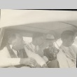 Franklin D. Roosevelt and others sitting in a car wearing leis (ddr-njpa-1-1638)