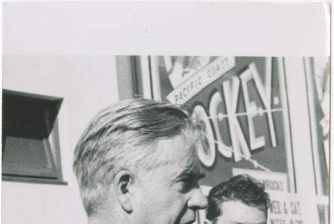 Man standing at microphone (ddr-densho-426-1046)