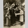 Eleanor Roosevelt receiving a gift from a group of teenagers (ddr-njpa-1-1532)