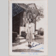 Woman standing outside building, with cat (ddr-densho-464-80)