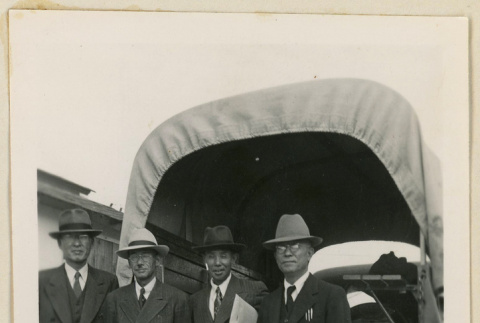 Co-op delegates pose in front of a truck (ddr-densho-37-863)