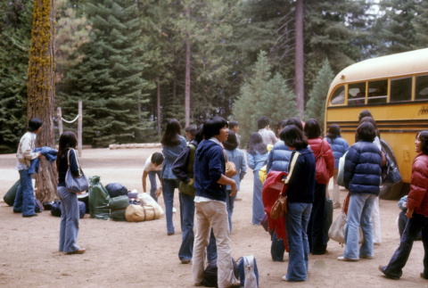 Campers preparing to board a bus (ddr-densho-336-747)
