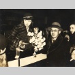 A man giving flowers to a woman on a train (ddr-njpa-4-2466)