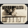 Baby playing in a crib (ddr-densho-542-650)
